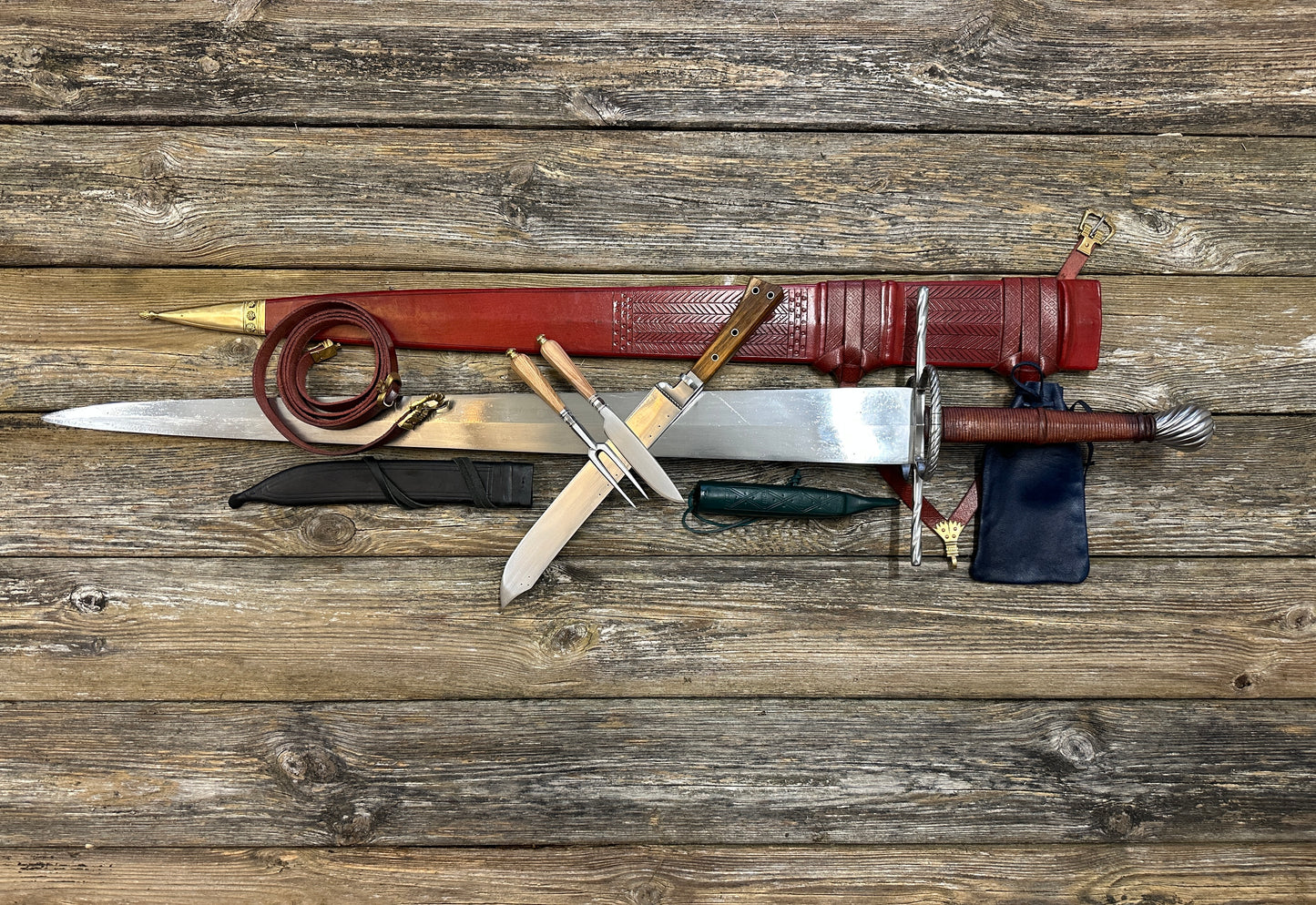 The Big Weapon Bundle. Sword, knife, eating set with sheathes and leather pouch.