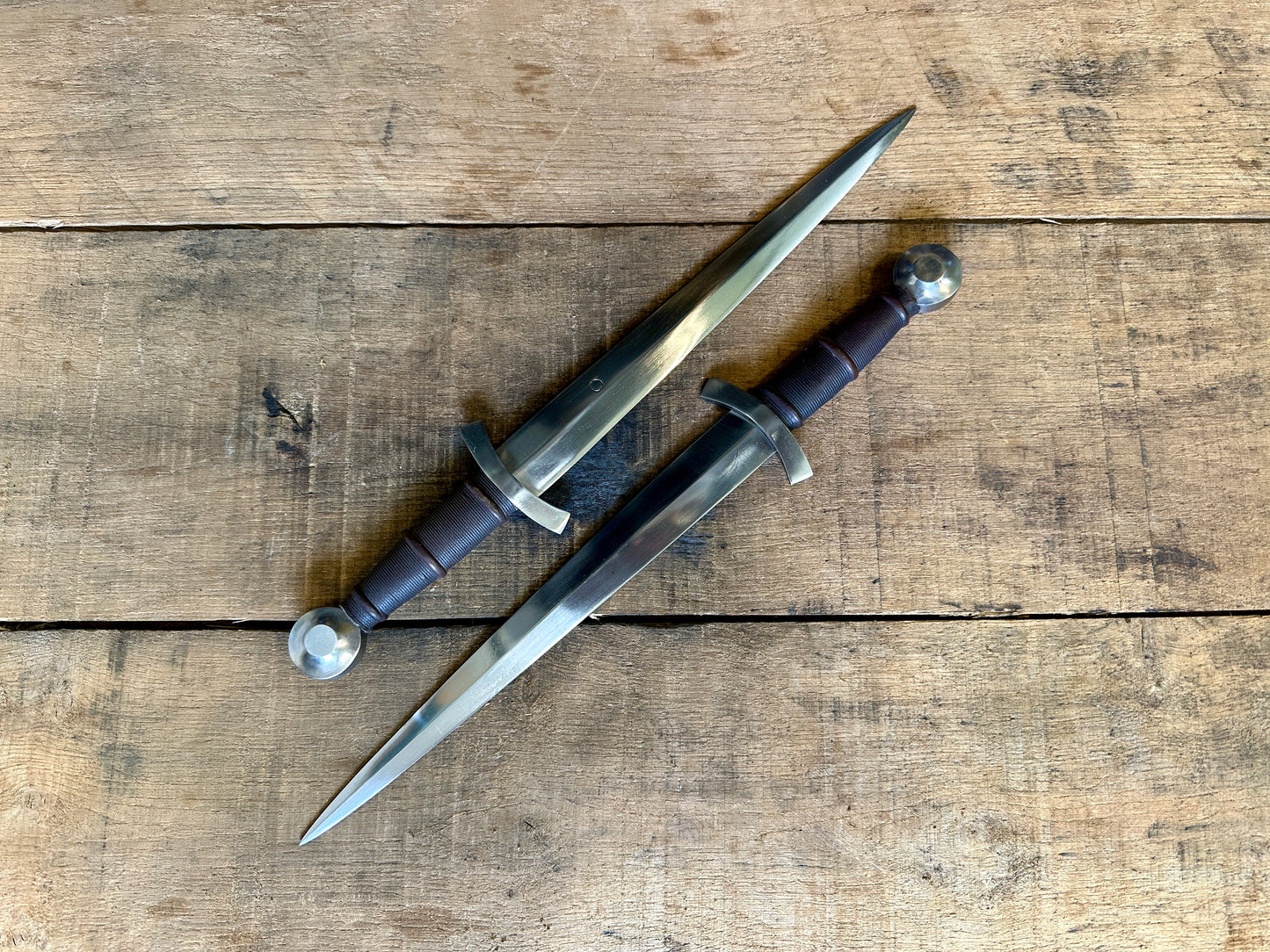 14thC Quillon Dagger. Two daggers facing different directions