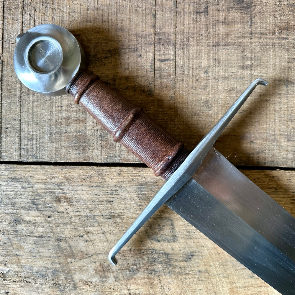 
                  
                    Castillon single handed sword. Close up of guard, grip and pommel
                  
                