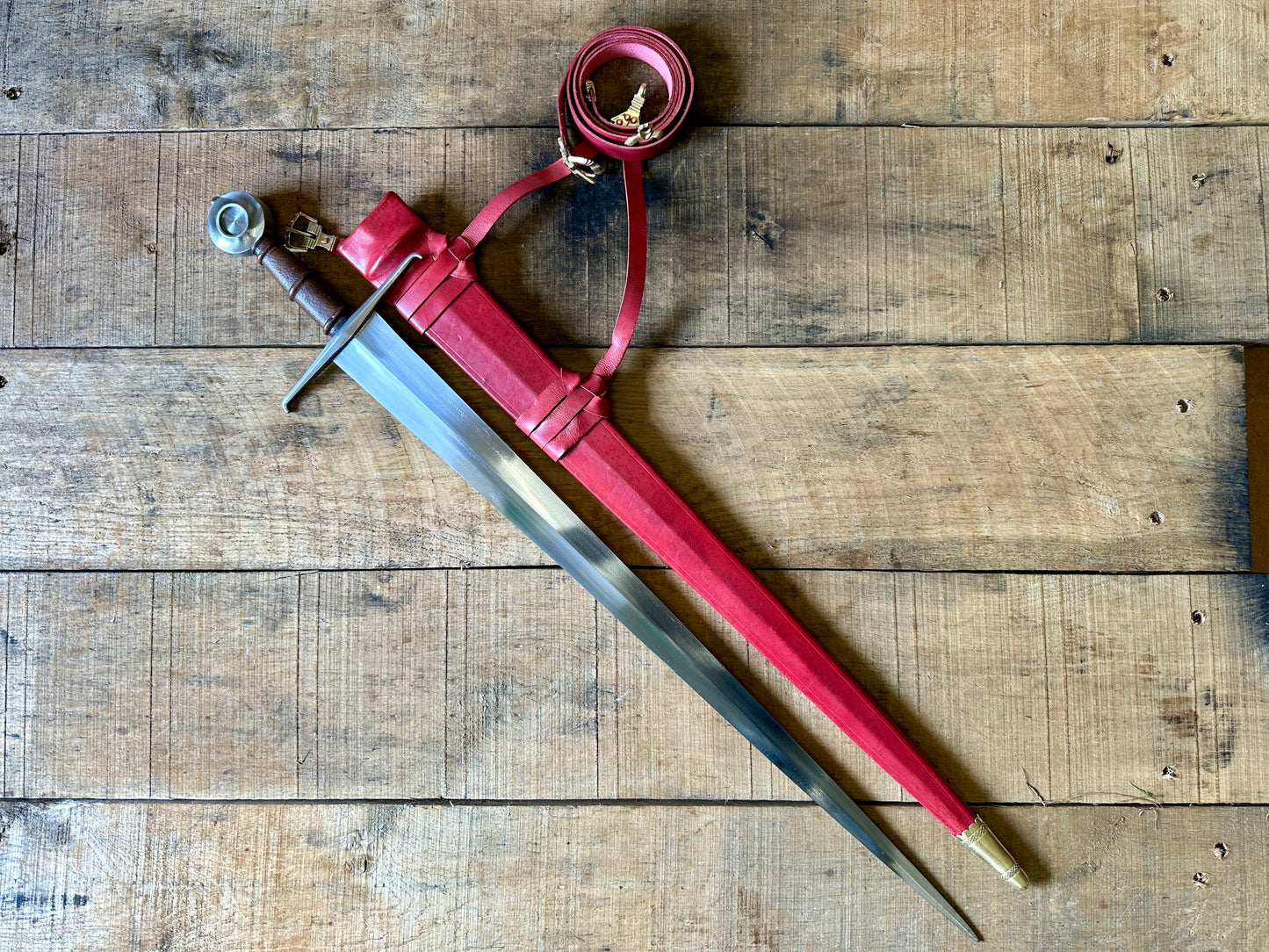 
                  
                    Castillon single handed sword with red scabbard
                  
                
