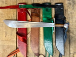 Cleaver Falchion from Tod Cutler. Sword lying on scabbards demonstrating the colours red, brown, green and black
