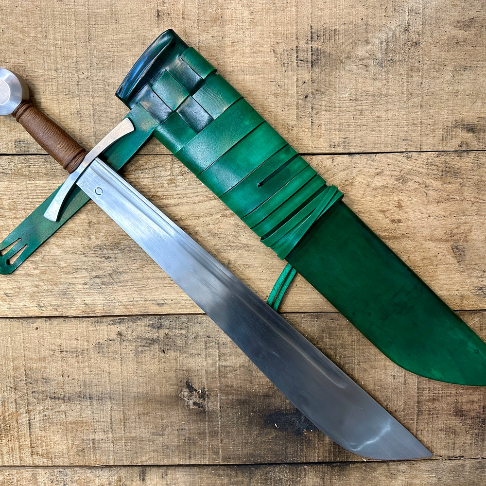 
                  
                    Cleaver Falchion from Tod Cutler. With a green scabbard. 
                  
                