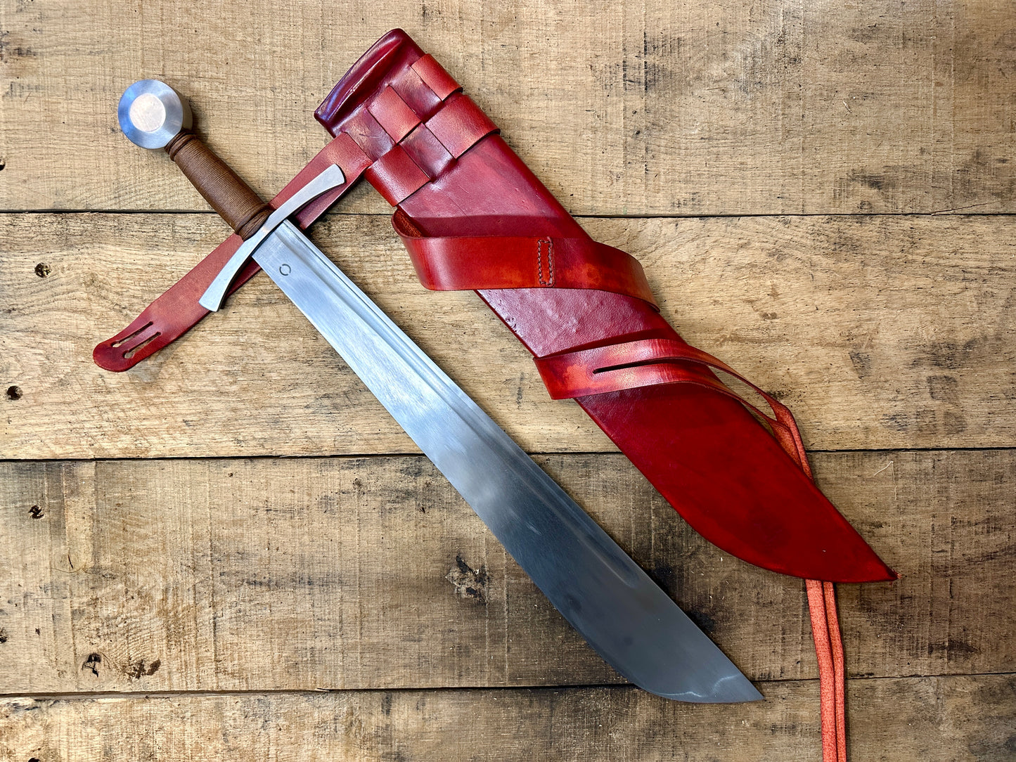 
                  
                    Cleaver Falchion from Tod Cutler. With a red scabbard. 
                  
                