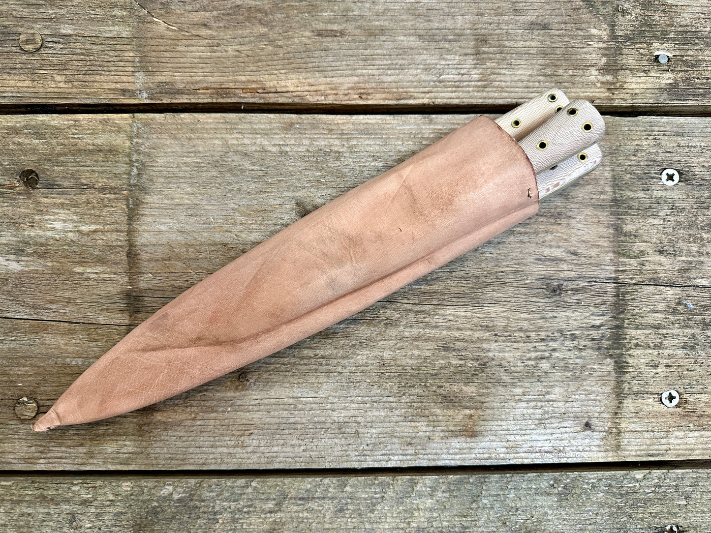 Set of three cooks knives in scabbards
