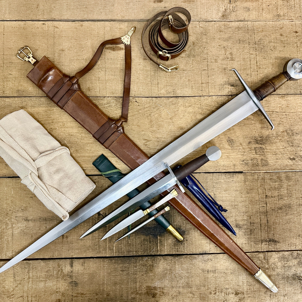 
                  
                    15thC Castillon Single handed sword, 12th-17th Quillon dagger and 15thC two piece eating set with sword bag (out of scabbards)
                  
                