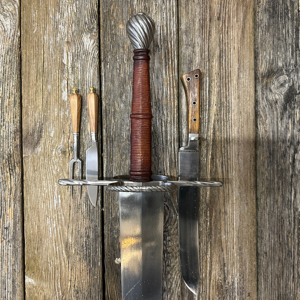 
                  
                    Set of knives and a sword on a wooden background
                  
                