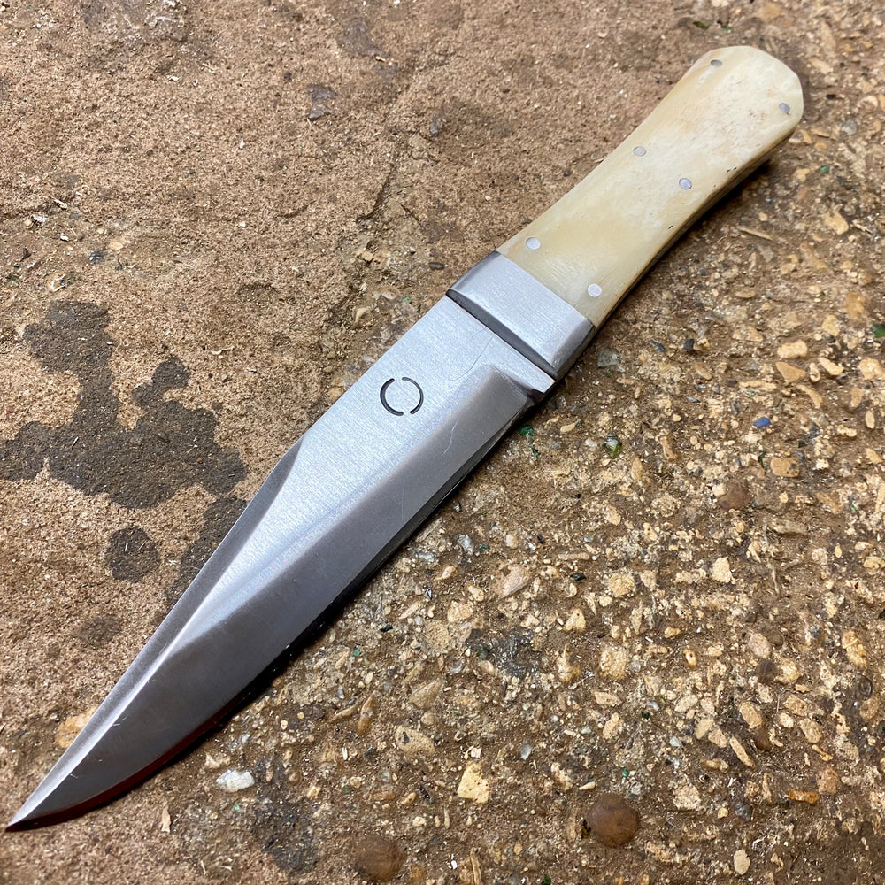 
                  
                    Bowie knife with bone handle
                  
                