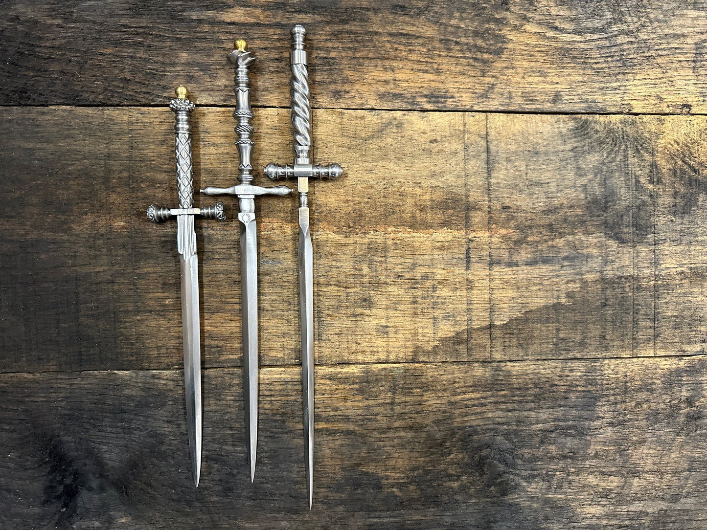 The Stibbert, the Pitt Rivers and the original Tod Cutler Stiletto daggers on a piece of wood. 