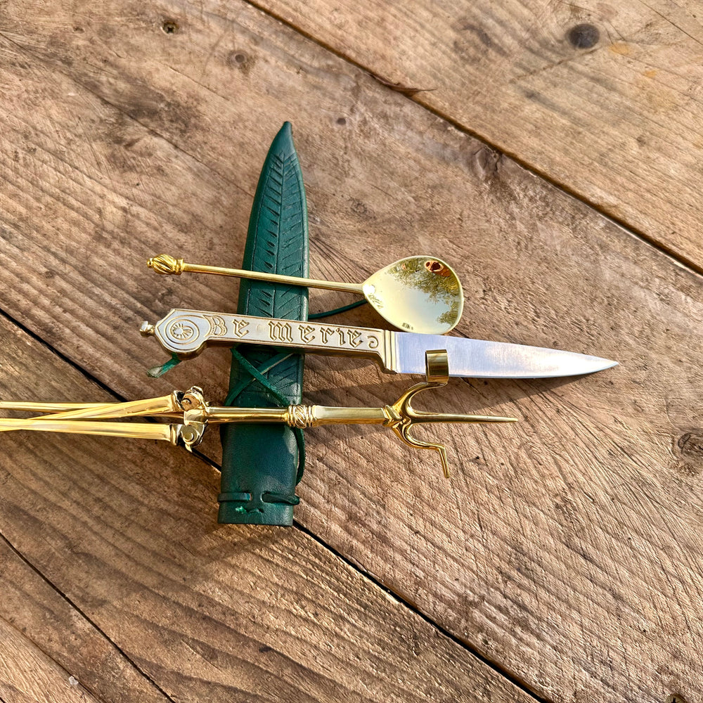 
                  
                    Tod Cutler Christinas bundle of joy - be merie eating knife, brass spoon, brass candlestick
                  
                