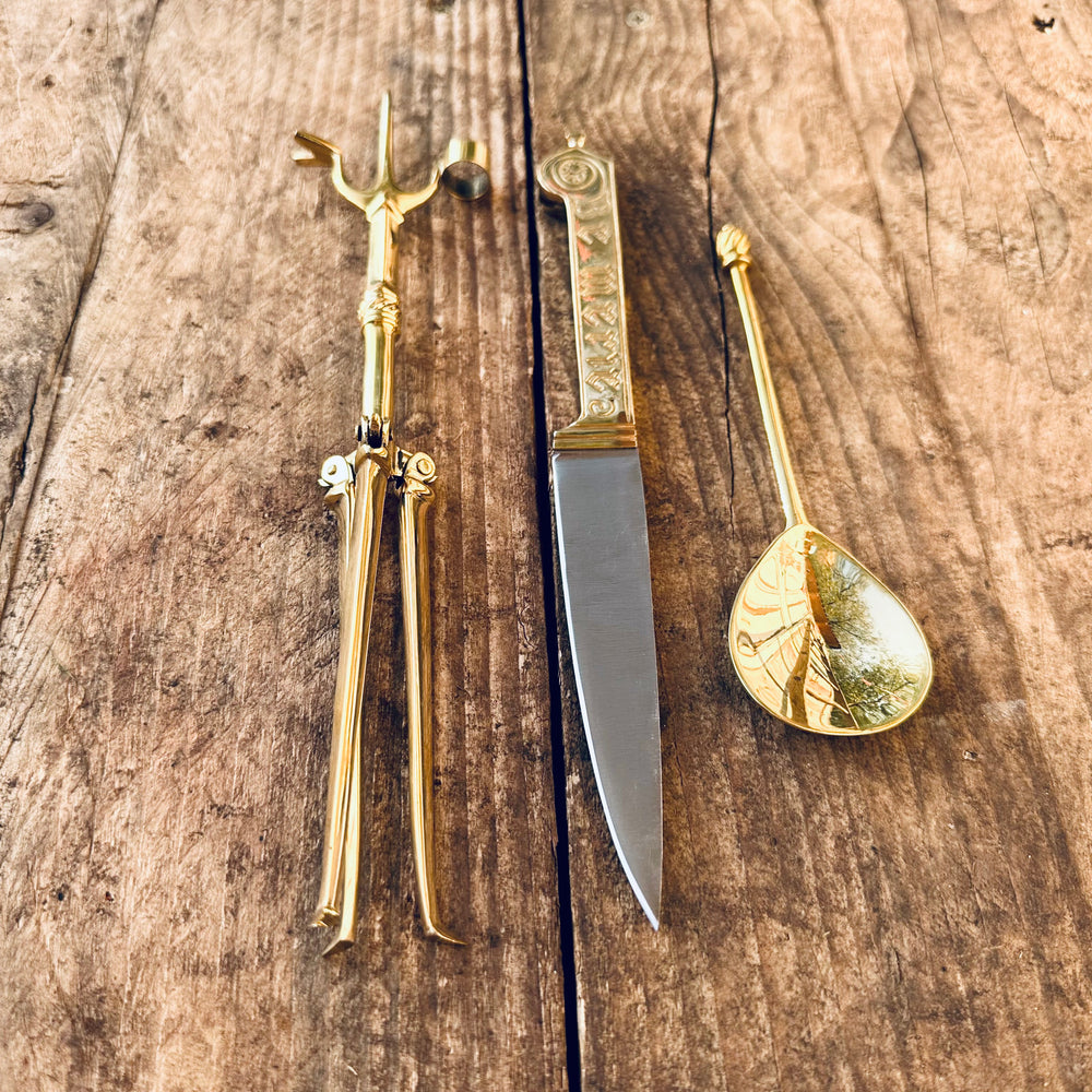 
                  
                    Tod Cutler Christinas bundle of joy - be merie eating knife, brass spoon, brass candlestick
                  
                