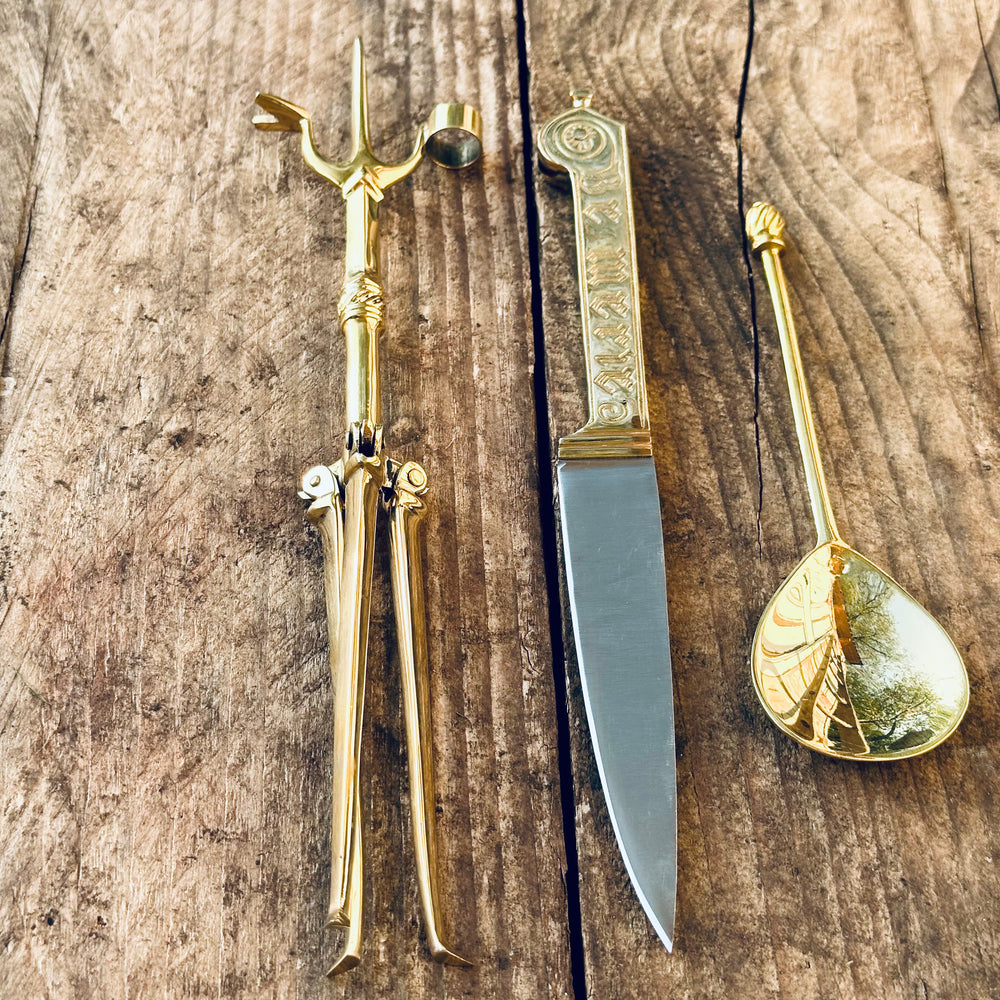 
                  
                    Tod Cutler Christinas bundle of joy - be merie eating knife, brass spoon, brass candlestick
                  
                