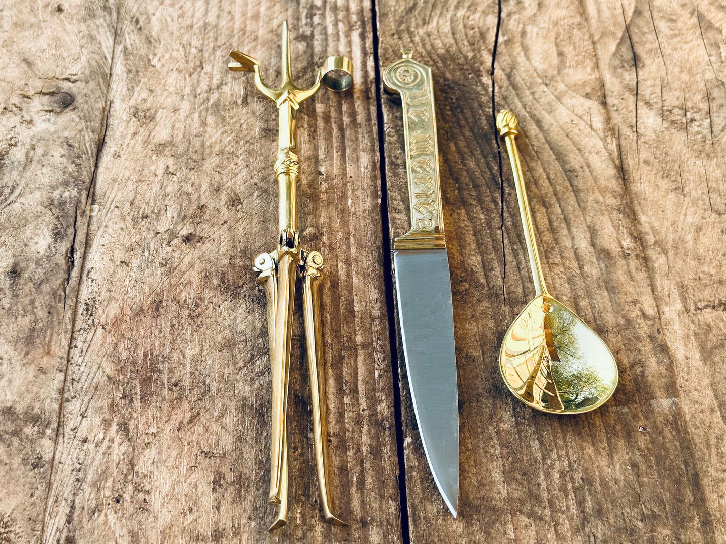 
                  
                    Tod Cutler Christinas bundle of joy - be merie eating knife, brass spoon, brass candlestick
                  
                