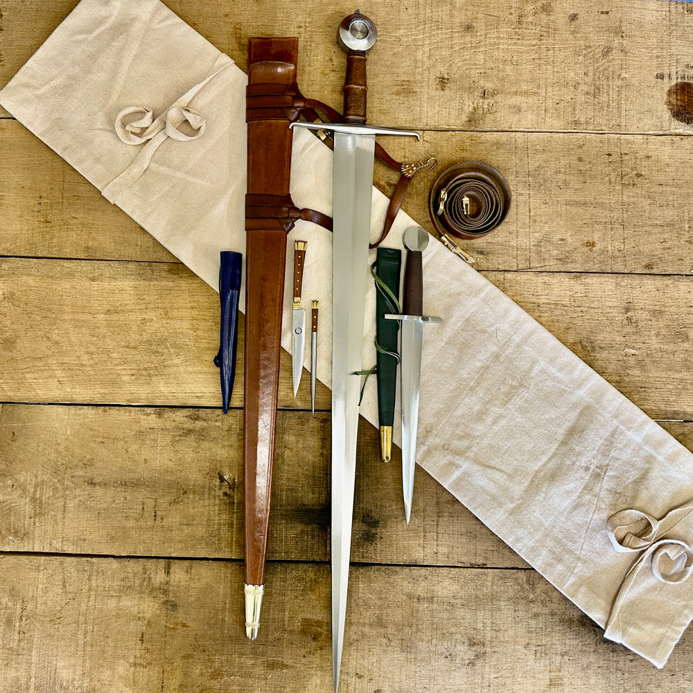 
                  
                    15th Century single handed sword, 12th - 17th century quillon dagger and 15th century two-piece eating set with sword bag (out of scabbards)
                  
                