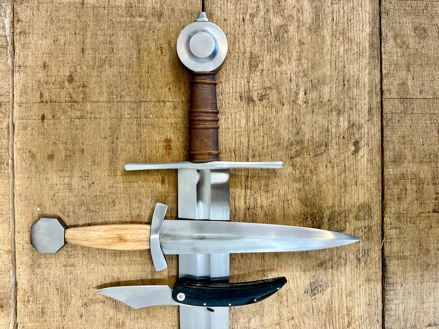 
                  
                    13 - 15th Century Single-handed sword, Late 13th Century Quillon Dagger, 13 - 15th Century Horn folding knife close-up (no scabbards)
                  
                