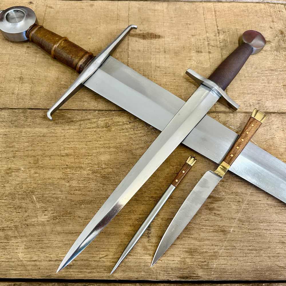 
                  
                    15th Century single handed sword, 12th - 17th century quillon dagger and 15th century two-piece eating set (close up)
                  
                