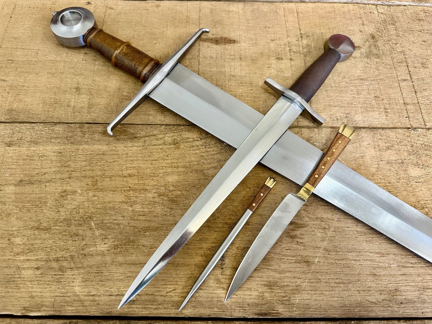 
                  
                    15th Century single handed sword, 12th - 17th century quillon dagger and 15th century two-piece eating set (close up)
                  
                