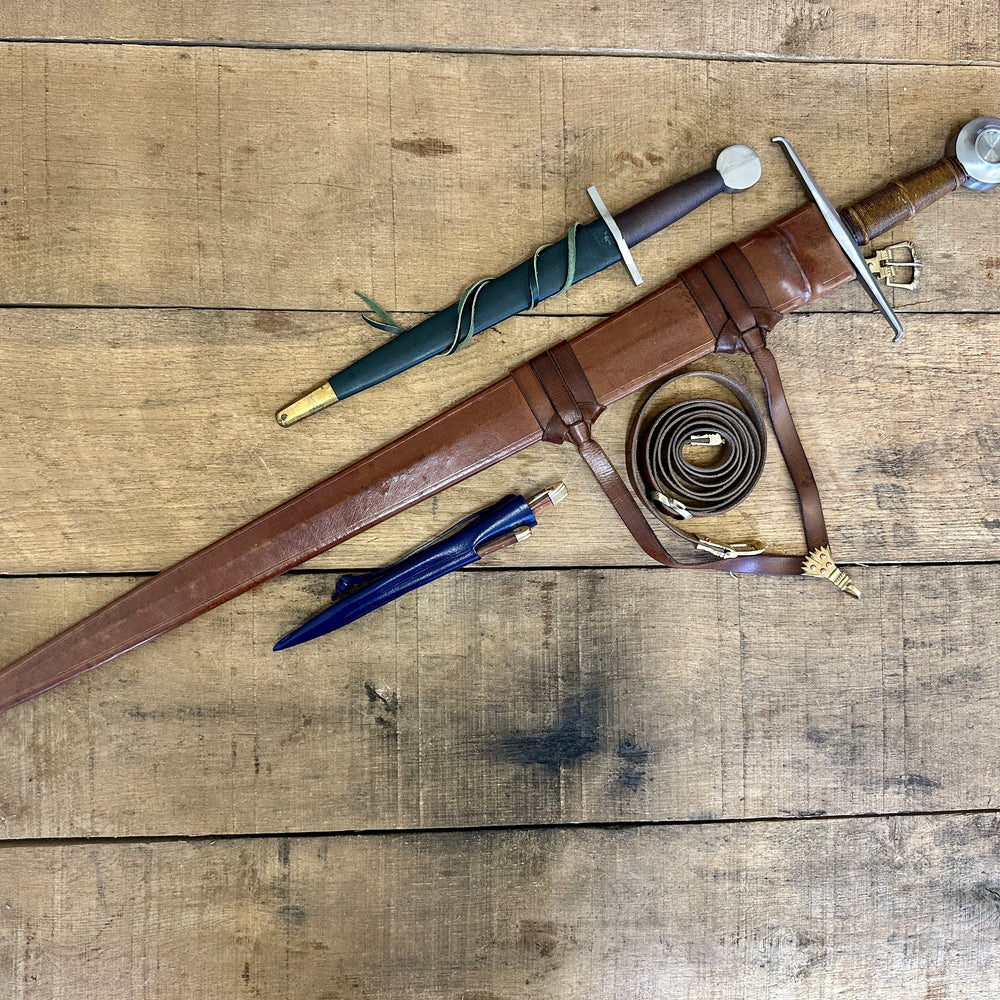 
                  
                    15th Century single handed sword, 12th - 17th century quillon dagger and 15th century two-piece eating set (in scabbards linear)
                  
                