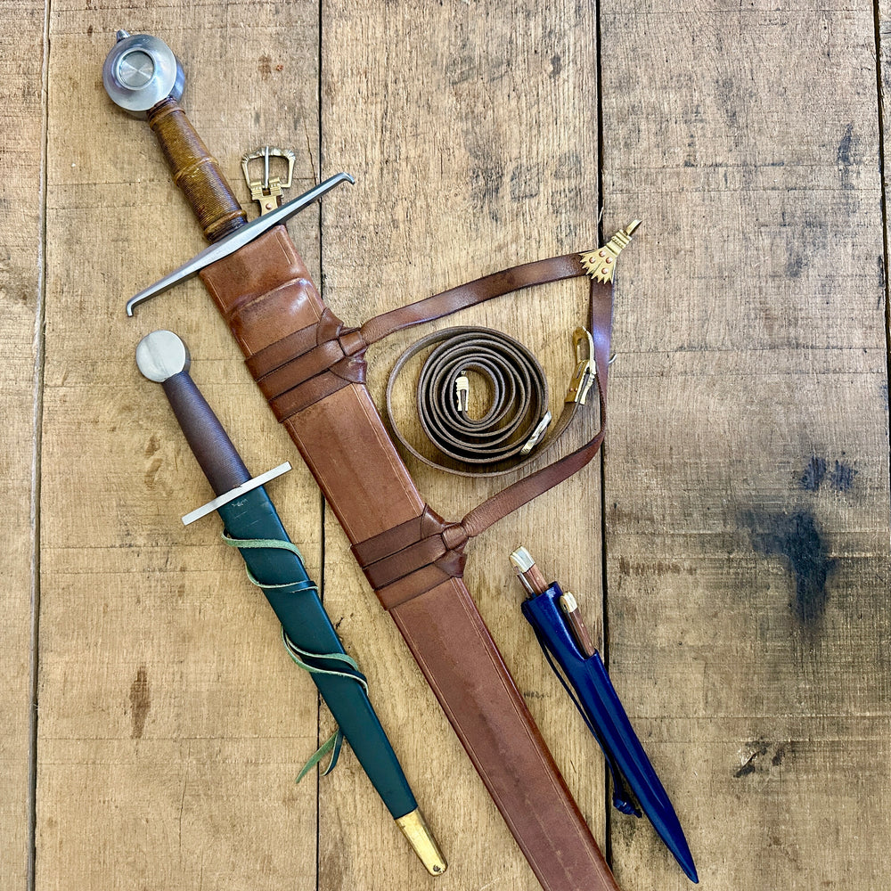 
                  
                    15th Century single handed sword, 12th - 17th century quillon dagger and 15th century two-piece eating set (in scabbards)
                  
                