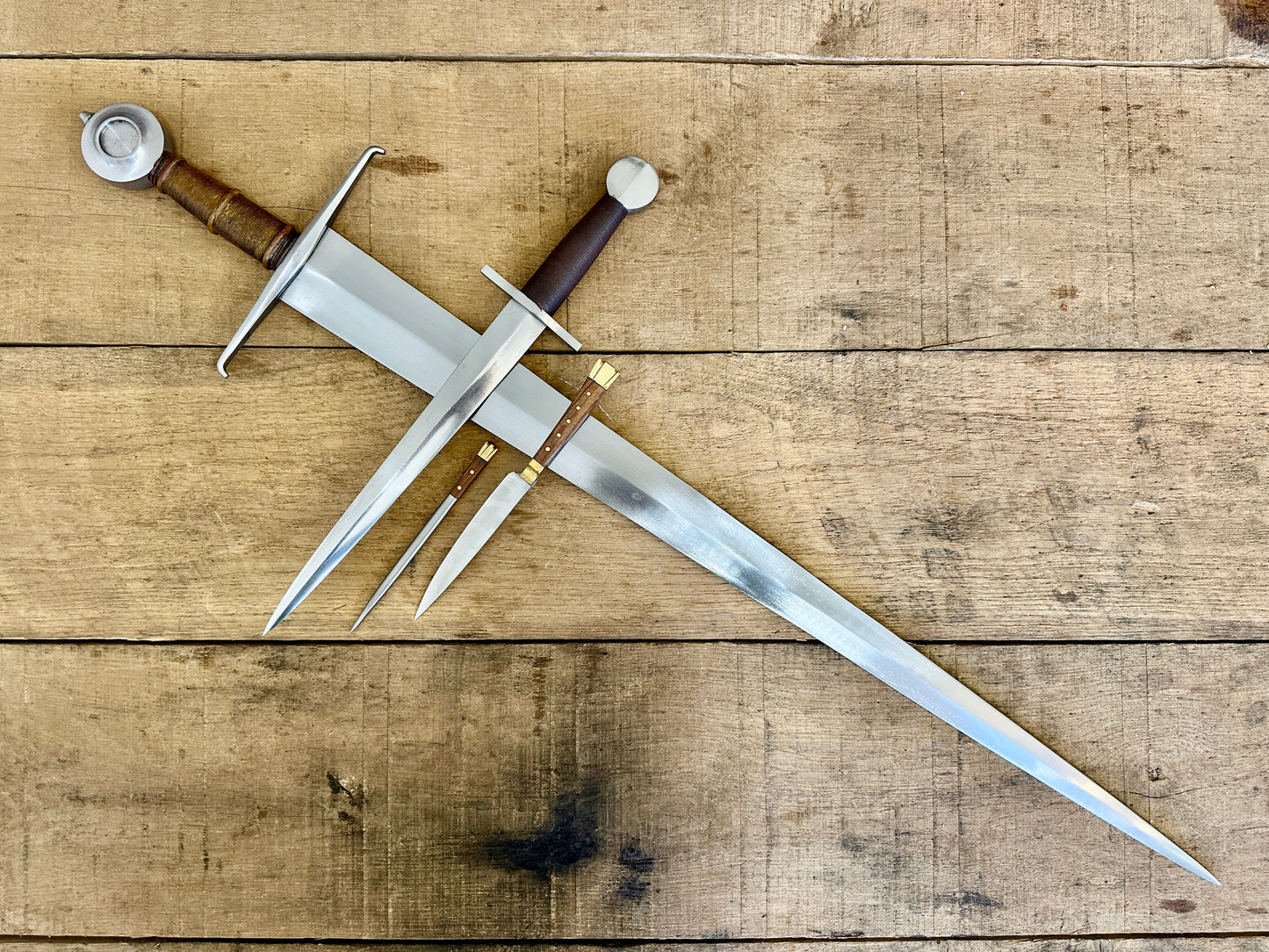 15th Century single handed sword, 12th - 17th century quillon dagger and 15th century two-piece eating set (no scabbards)