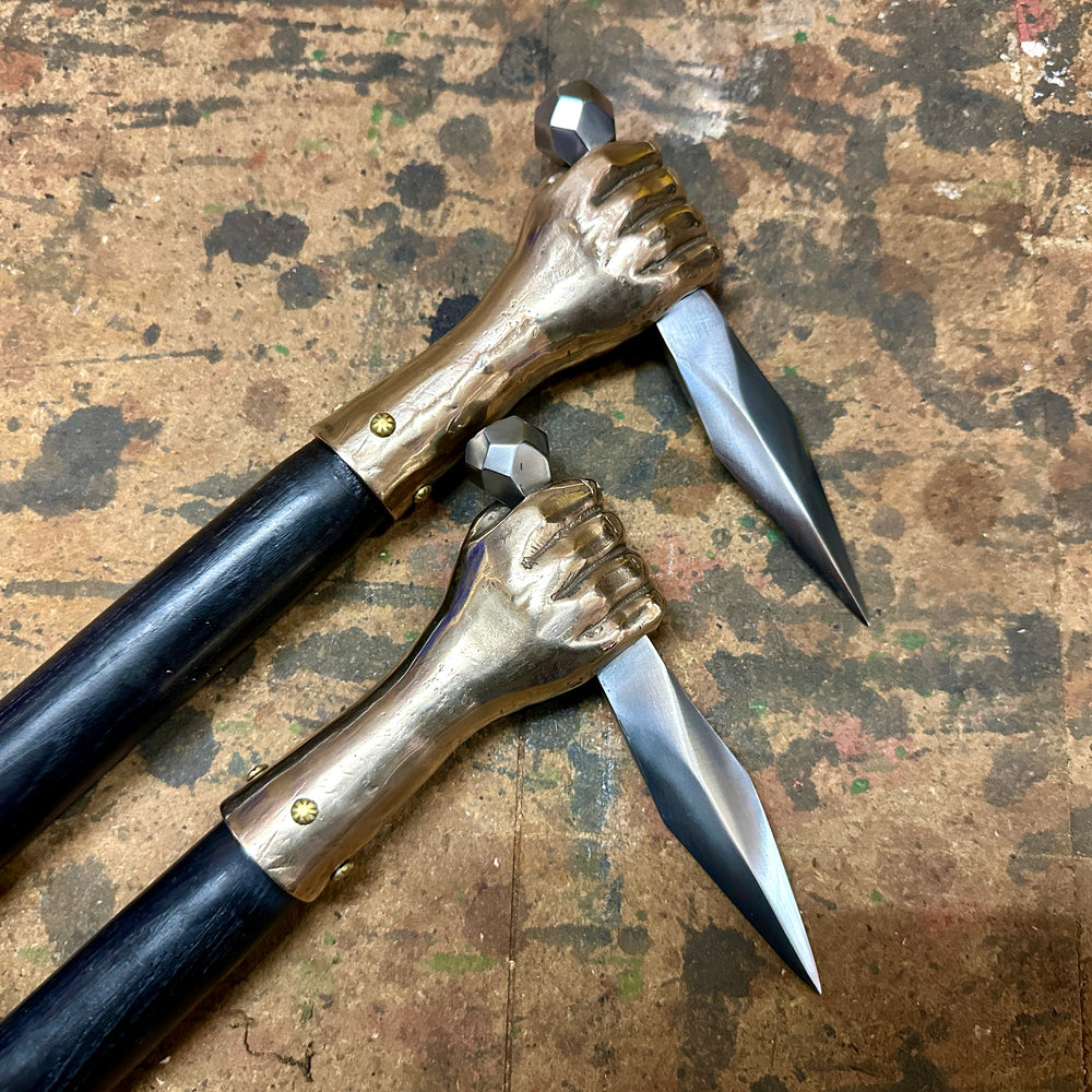 two fist hammers side by side close up