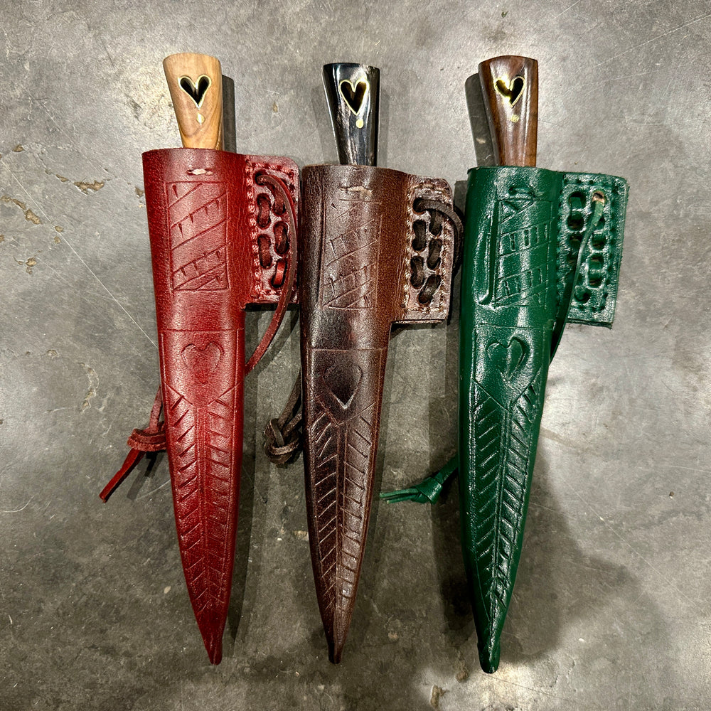 
                  
                    Set of three eating knives in their scabbards

                  
                