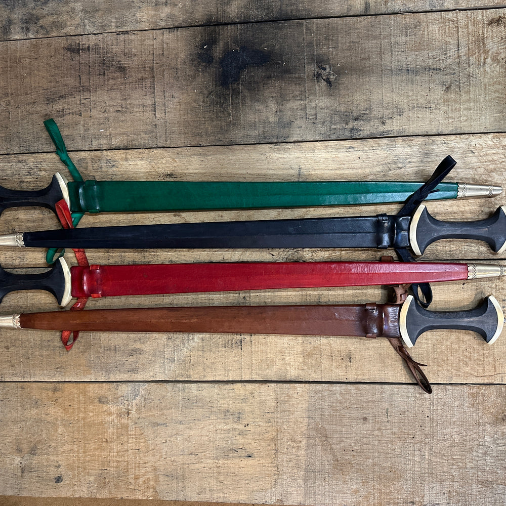 Long Swiss Degen from Tod Cutler. Four swords in scabbards demonstrating the colours red, green, black and brown. 