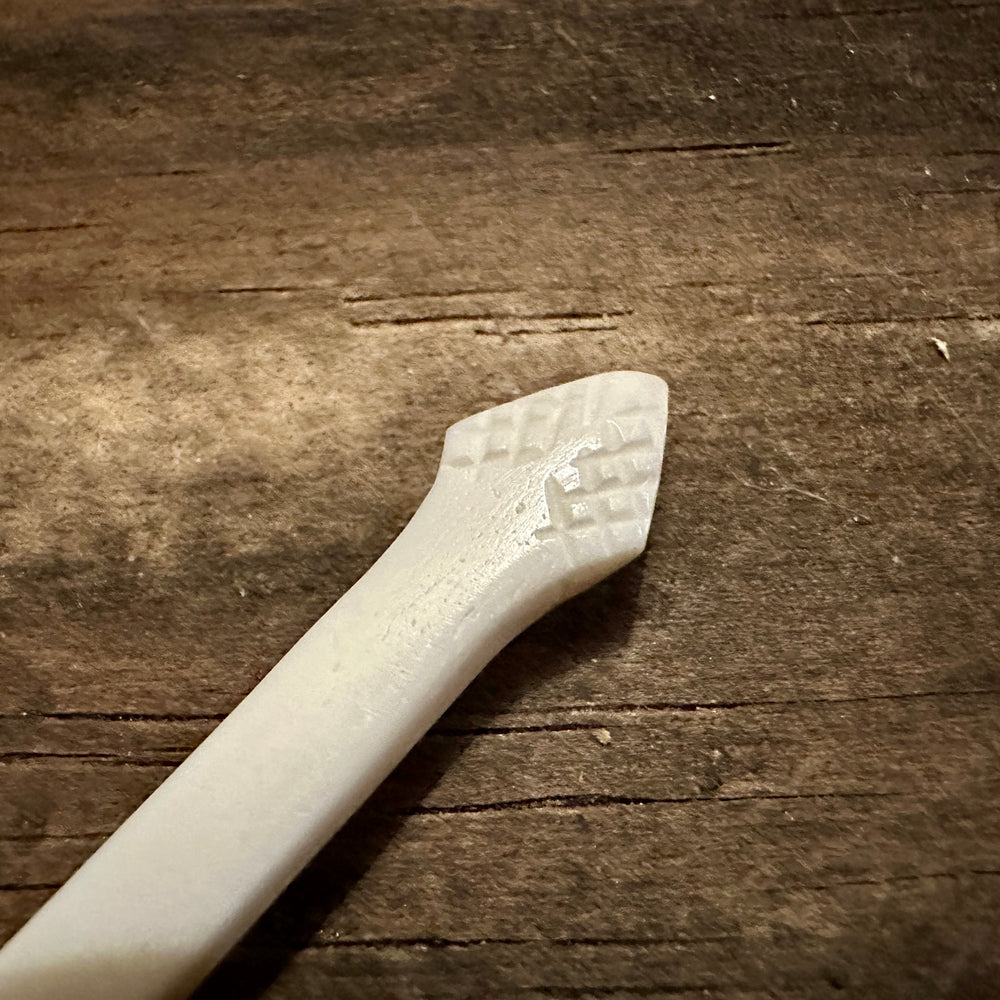 
                  
                    Feather finial bone spoon 
                  
                