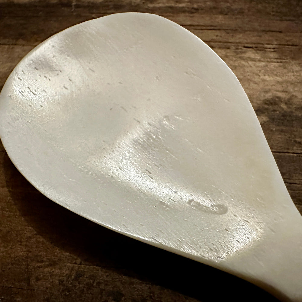 
                  
                    Feather finial bone spoon 
                  
                