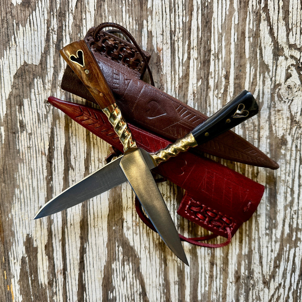 
                  
                    Lovers Bundle. Wooden heart knife and horn heart knife and two sheathes
                  
                