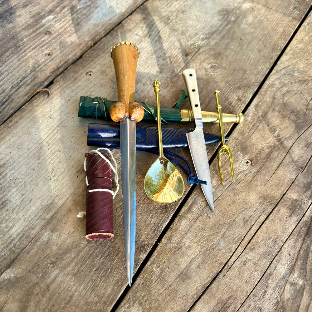 
                  
                    Tod Cutler My Lady's Bundle with purse bollock dagger, tcp, brass spoon and fork,, leather needle case
                  
                