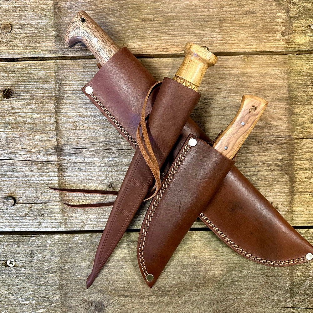 
                  
                    Camp knife, whittle tang dagger and field knife in scabbards
                  
                