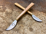 Tod Cutler penknives x2 in a criss cross pattern