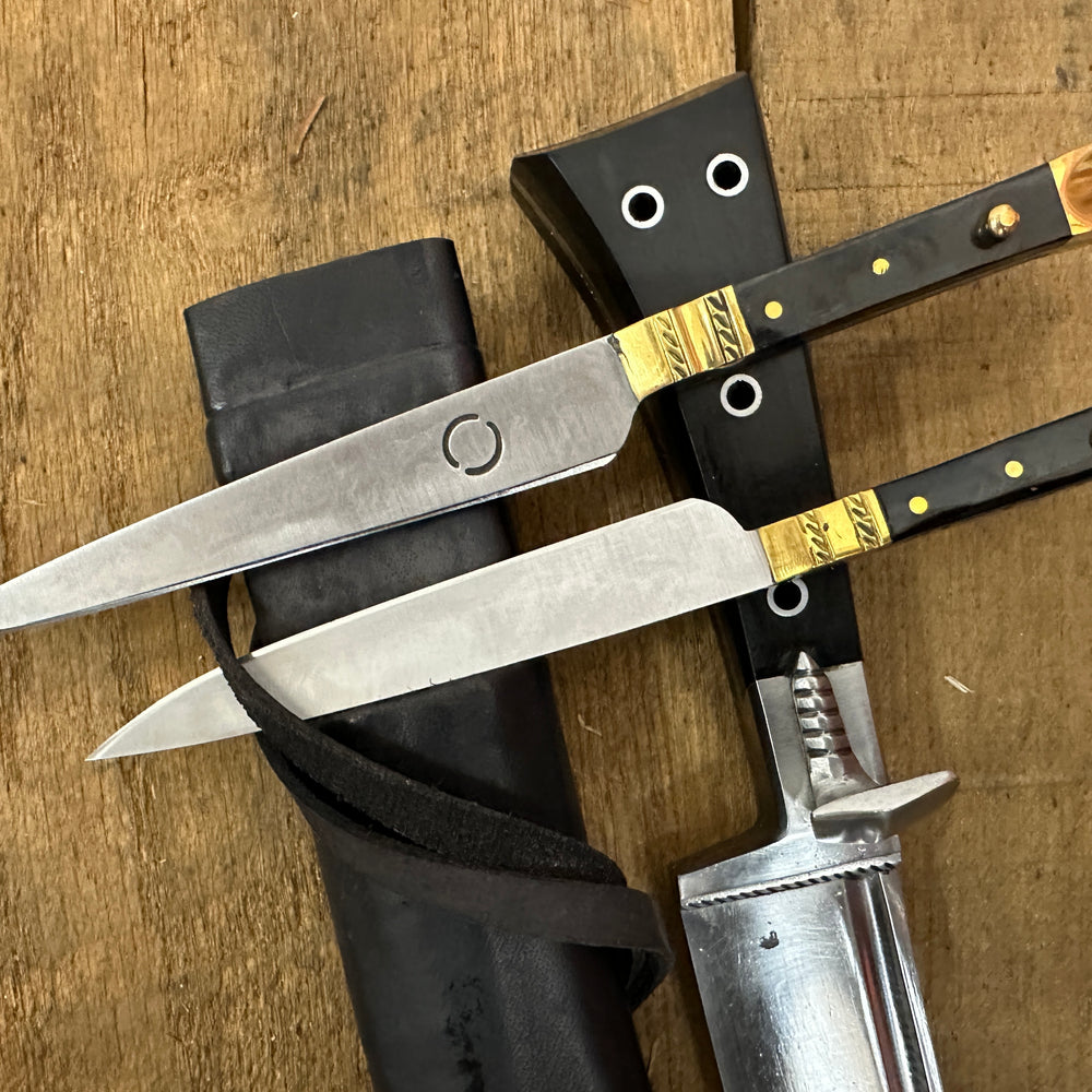 
                  
                    Bauernwehr with by knives with a black scabbard 
                  
                