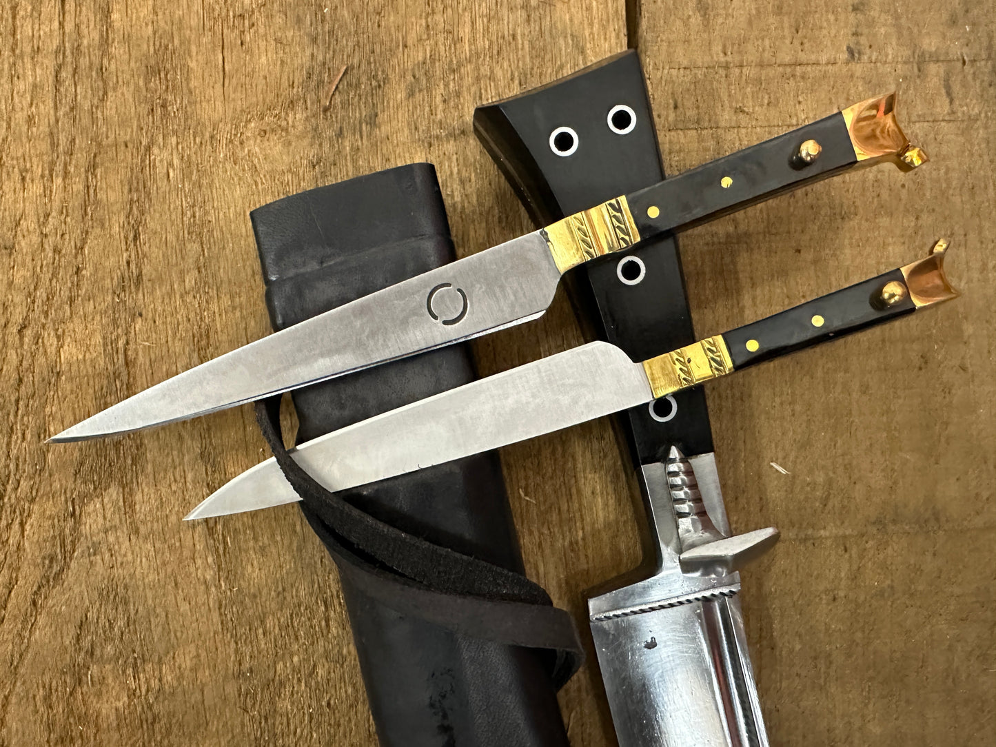 
                  
                    Bauernwehr with by knives with a black scabbard 
                  
                