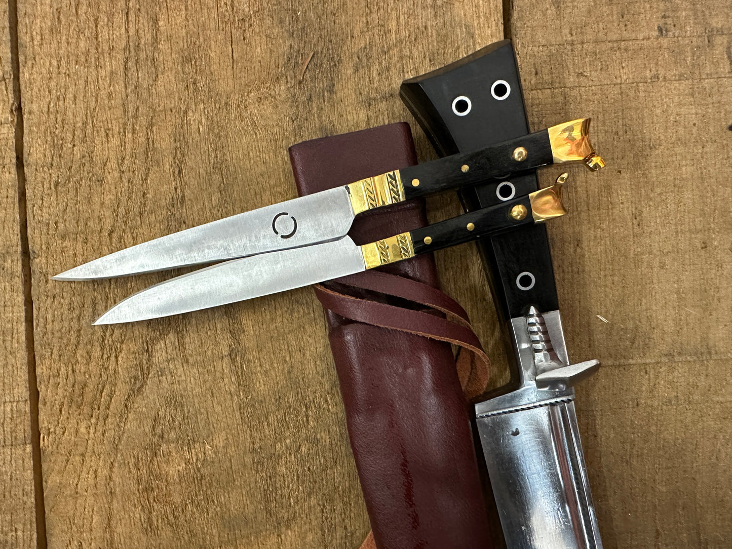 
                  
                    Bauernwehr with by knives with a red scabbard
                  
                