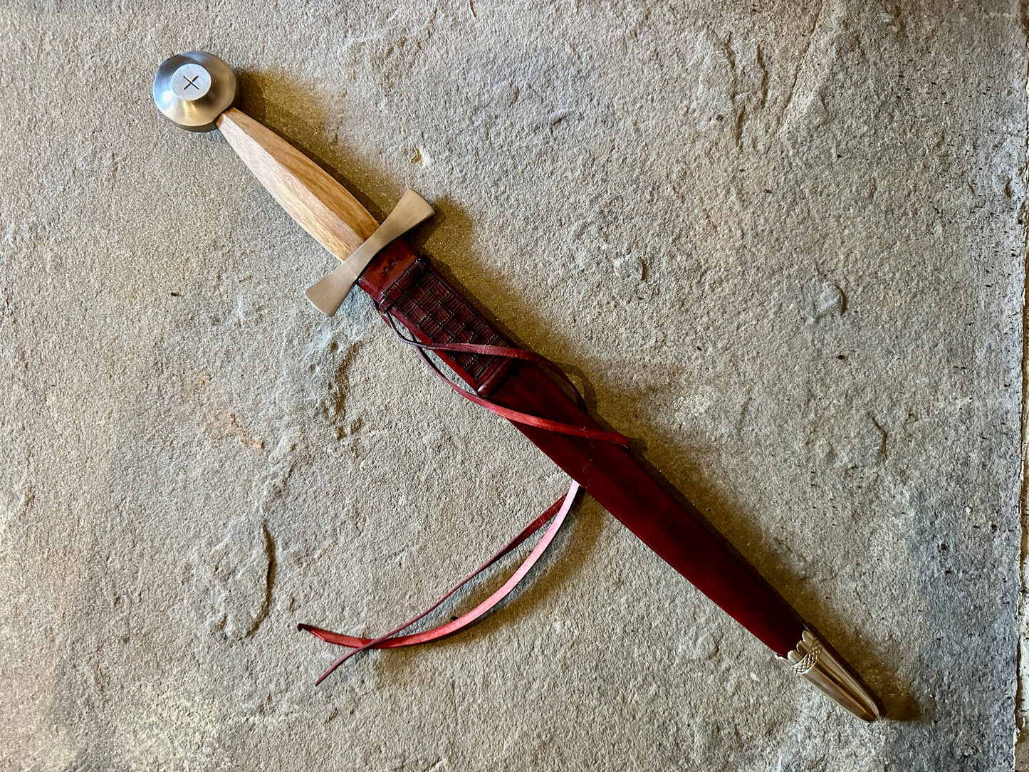 
                  
                    14thC Long Quillon in a red scabbard
                  
                