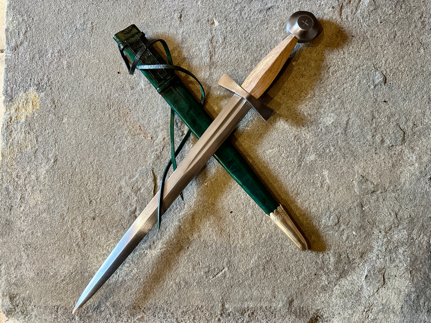 
                  
                    14thC Long Quillon with a green scabbard
                  
                