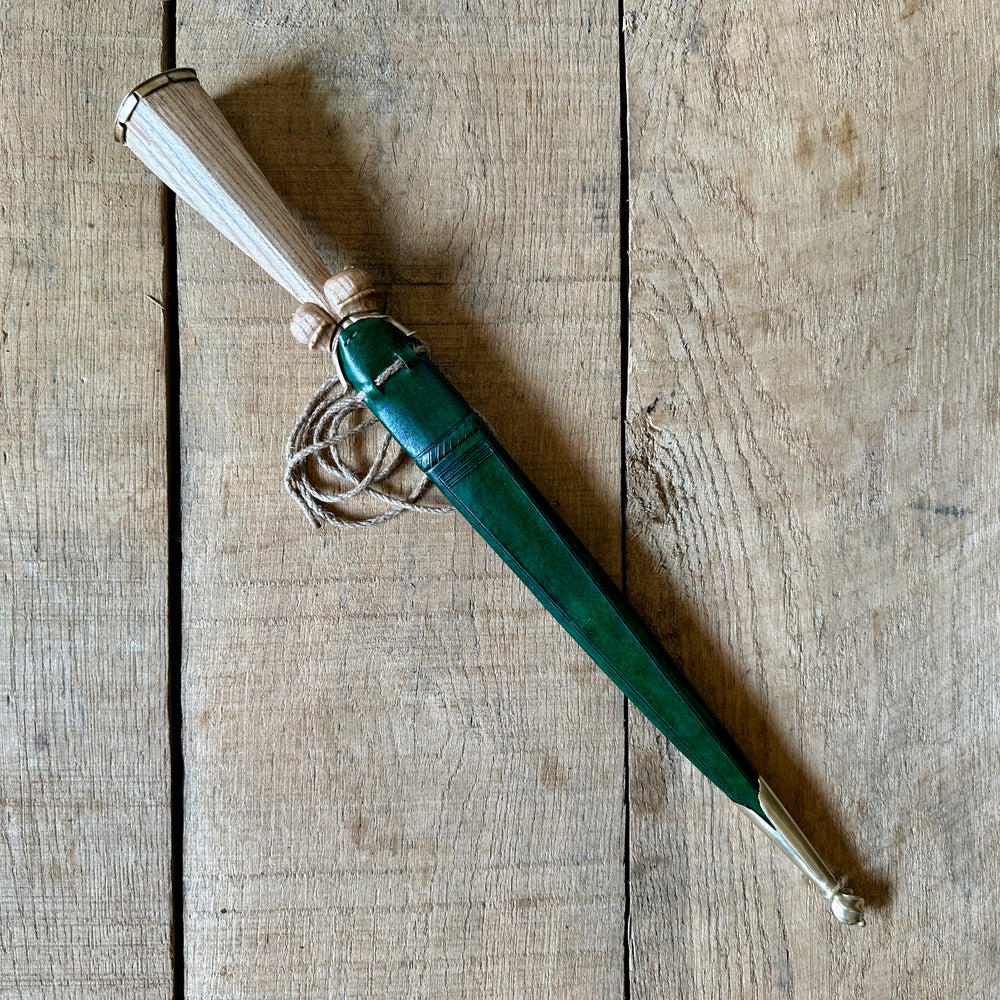 
                  
                    Simple Rothenburg Bollock Dagger in a green scabbard. 
                  
                