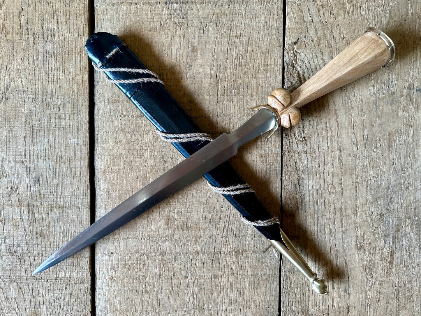 
                  
                    Simple Rothenburg Bollock Dagger with a black scabbard
                  
                