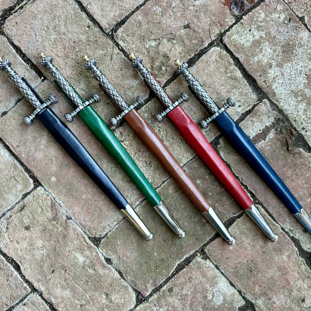 
                  
                    Stibbert Daggers in black, green, brown, red and blue scabbards
                  
                