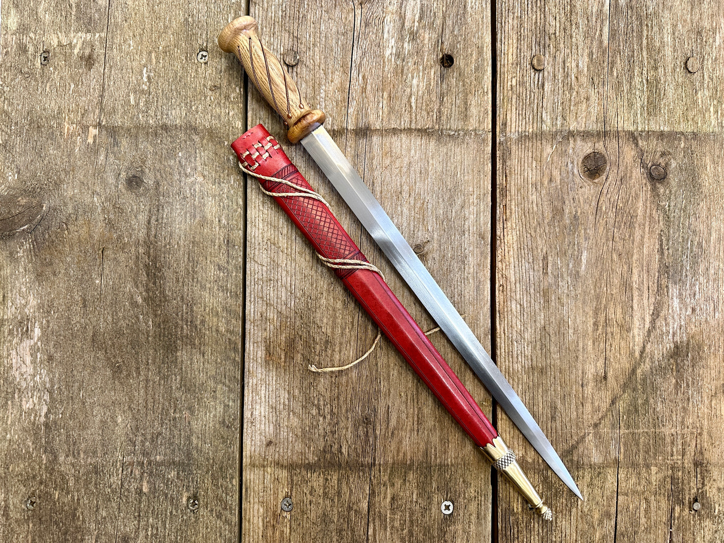 
                  
                    soldiers rondel with a red sheath
                  
                