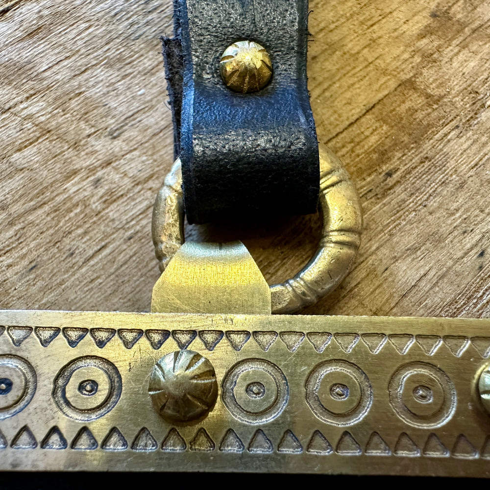 
                  
                    Decorated Anglo Saxon/Viking knives close up of brass ring and brasswork.

                  
                