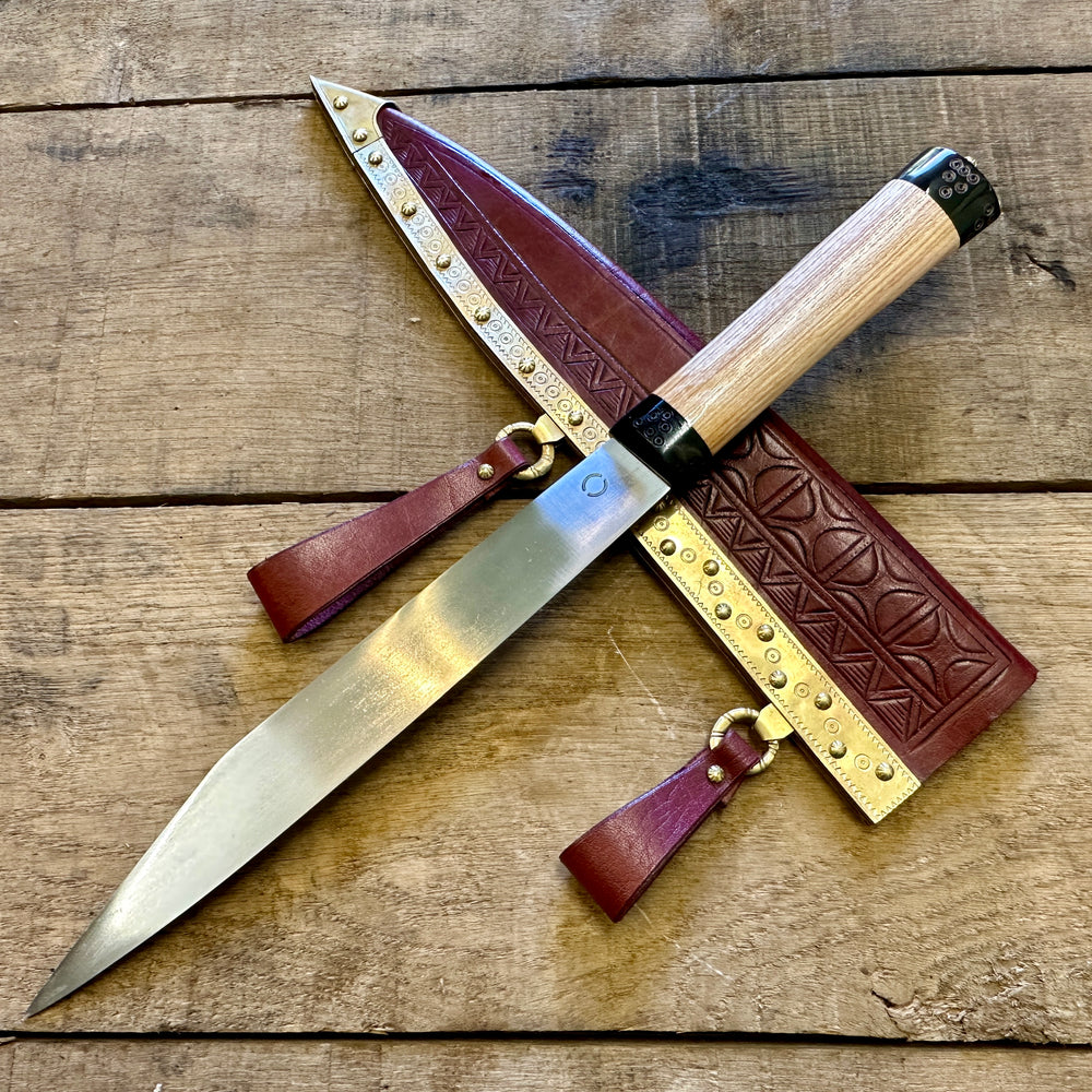 
                  
                    Decorated Anglo Saxon/Viking knife with a red scabbard
                  
                