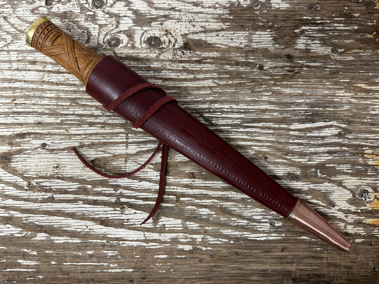 
                  
                    short irish skean in a red scabbard
                  
                