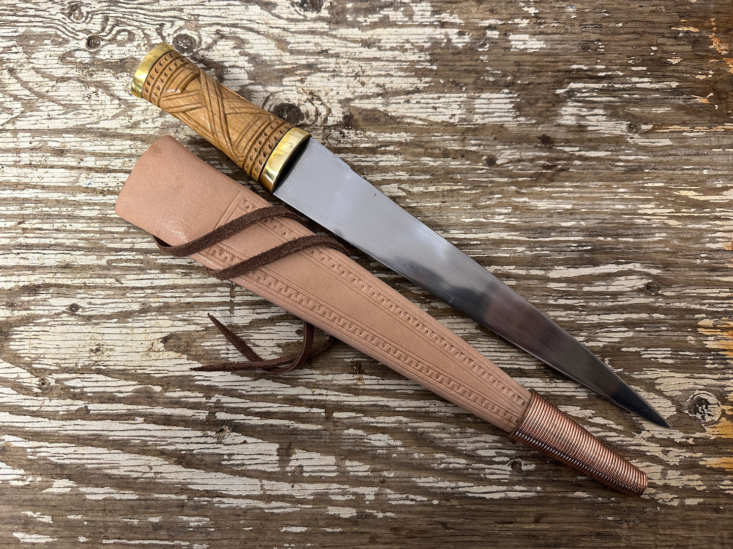 
                  
                    short irish skean with a natural scabbard 
                  
                