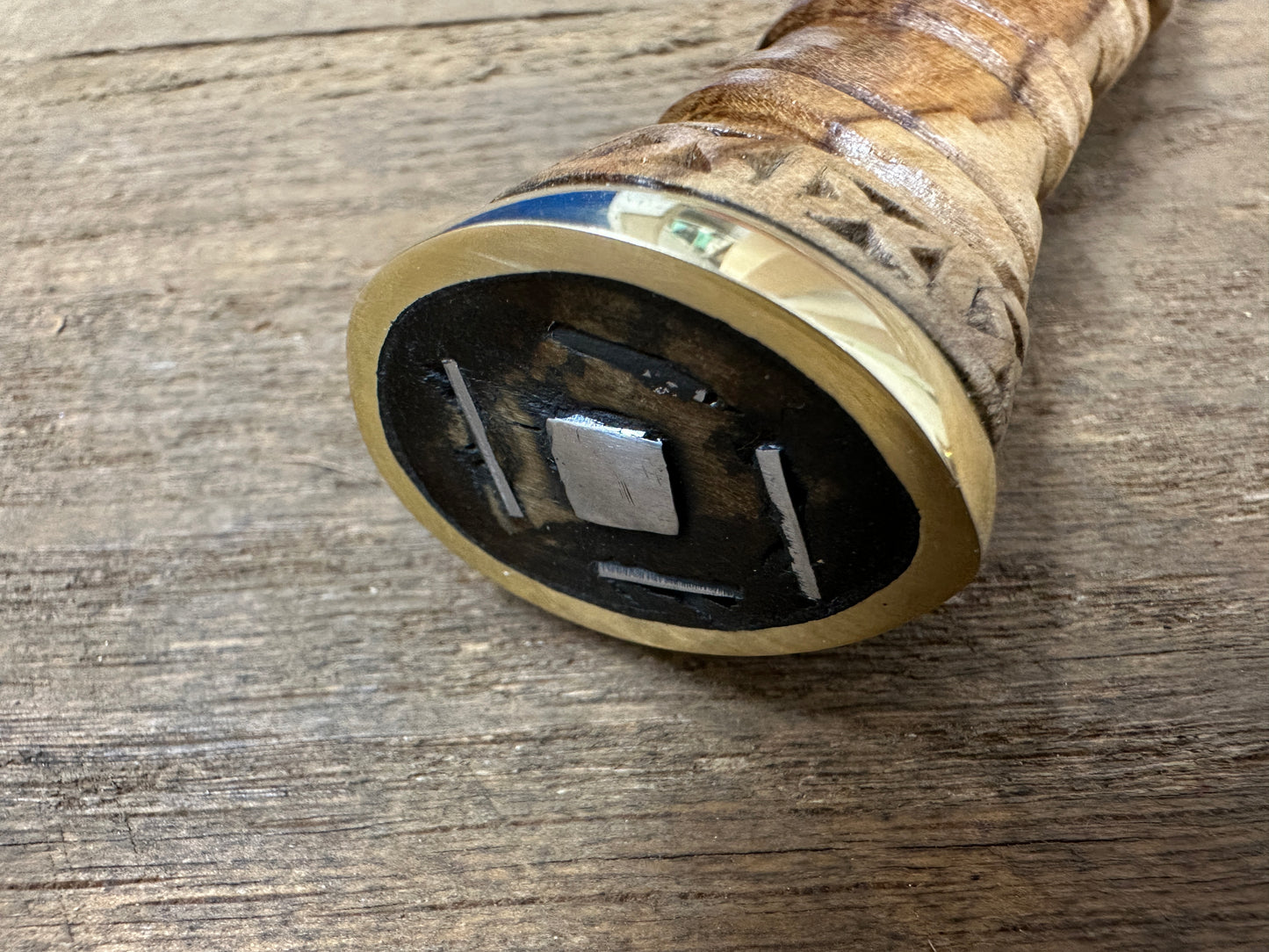 
                  
                    Close up of the end of the handle of a long Irish Skean showing the wedges.
                  
                