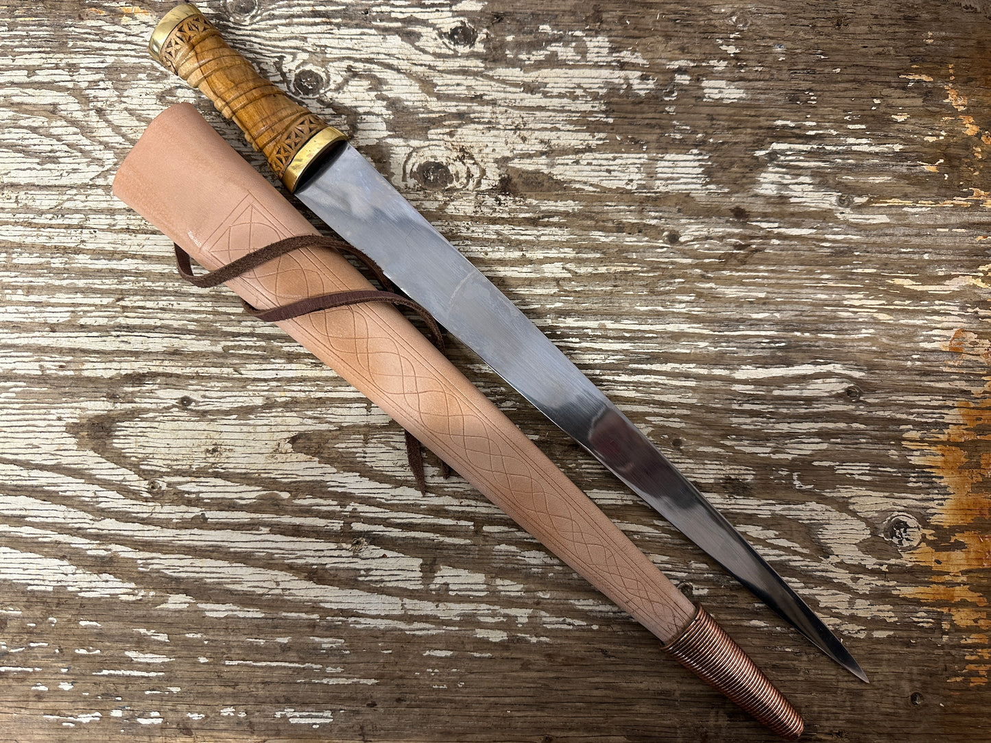 
                  
                    Long Irish Skean with a natural scabbard
                  
                