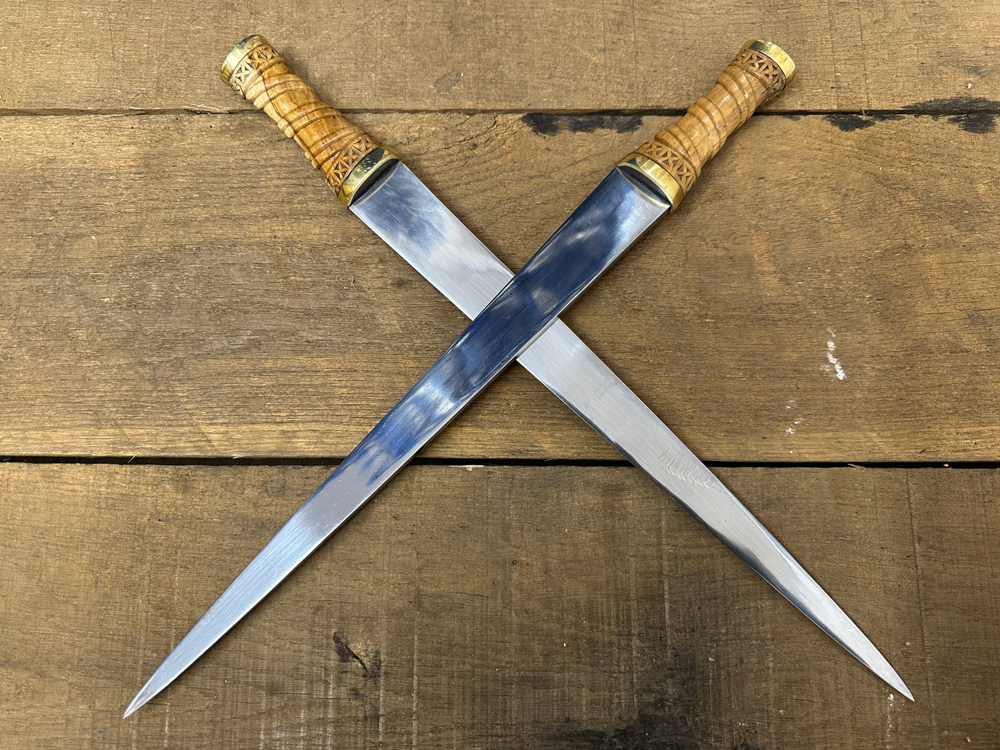 
                  
                    Two long Irish Skean crossed.
                  
                