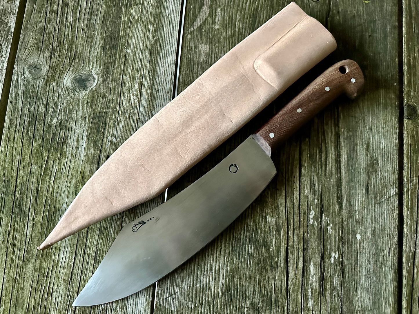 
                  
                    Tod Cutler Curved cleaver with leather sheath
                  
                