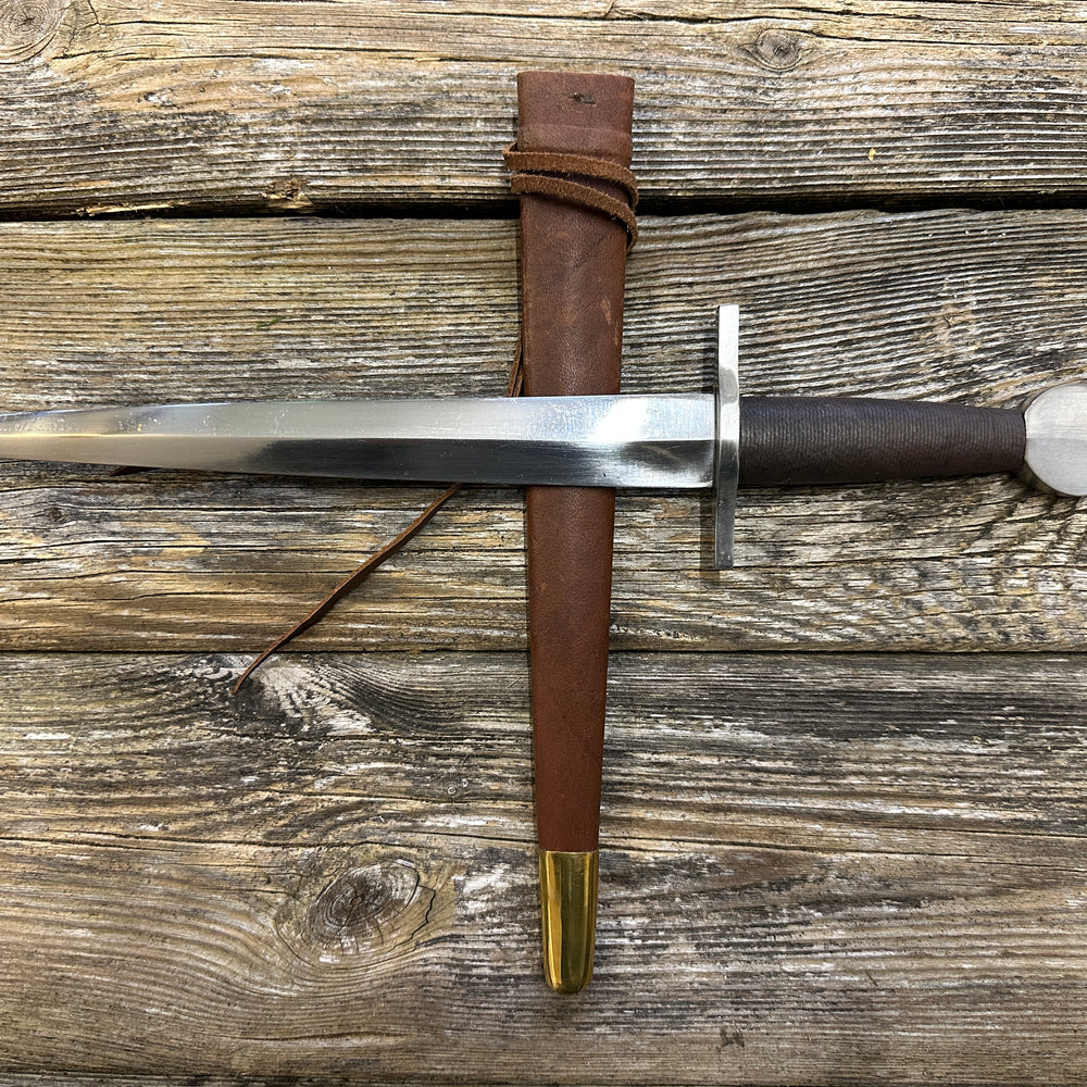 
                  
                    12-17thC Quillon Dagger with a brown scabbard

                  
                